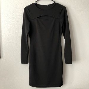 Fitted black dress with peekaboo